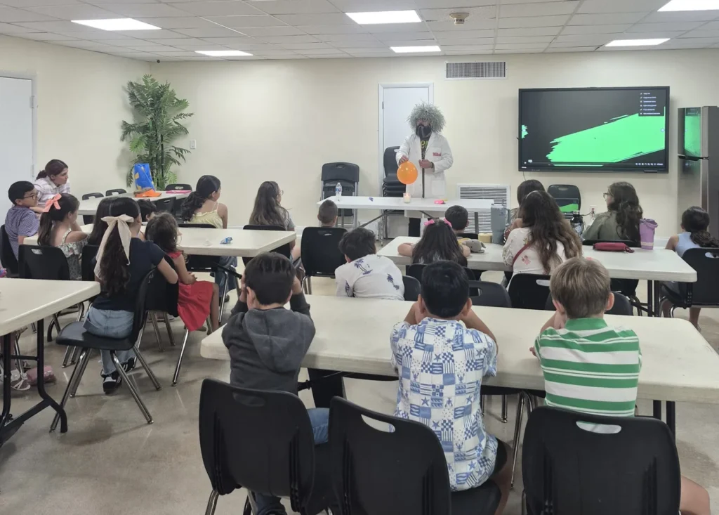 Children watching a science demonstration in a classroom